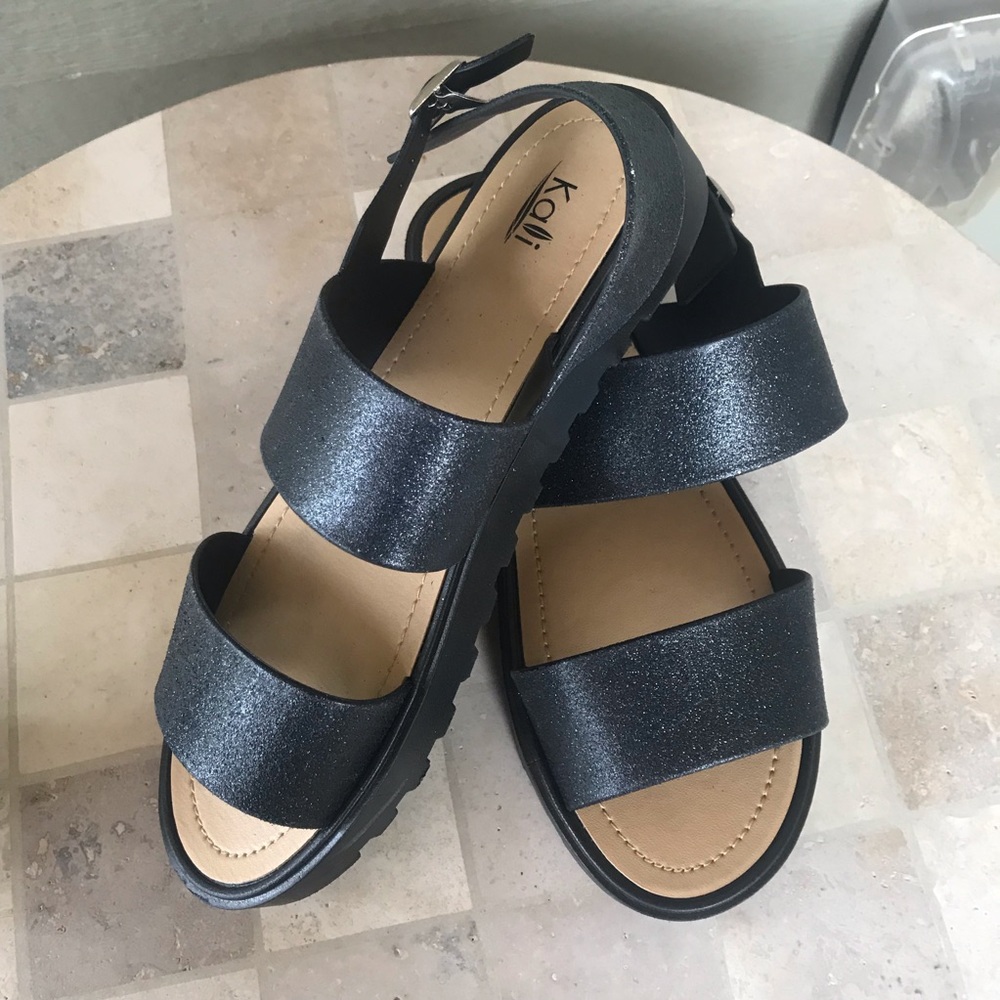 NWOT Kali Black Sandals in EUC.